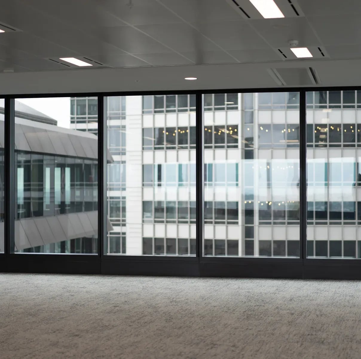 Modern empty office interior with large glass windows