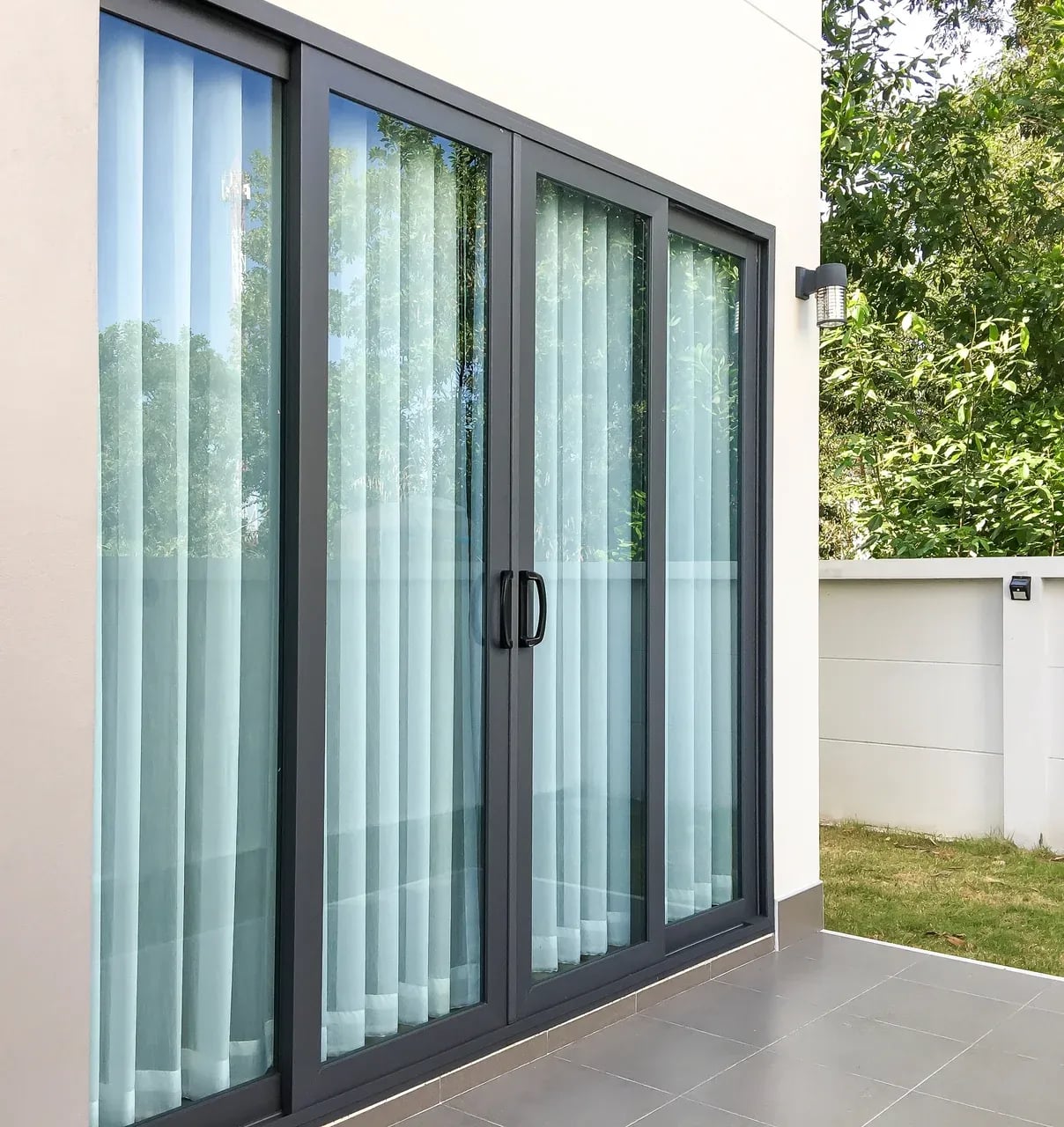 Perspective view of an installed custom aluminum sliding door