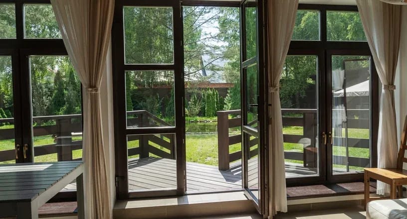 Glass French Doors with a garden view