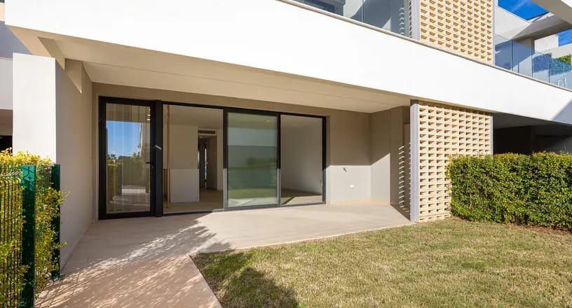 Pivot Glass Doors on a modern apartment patio